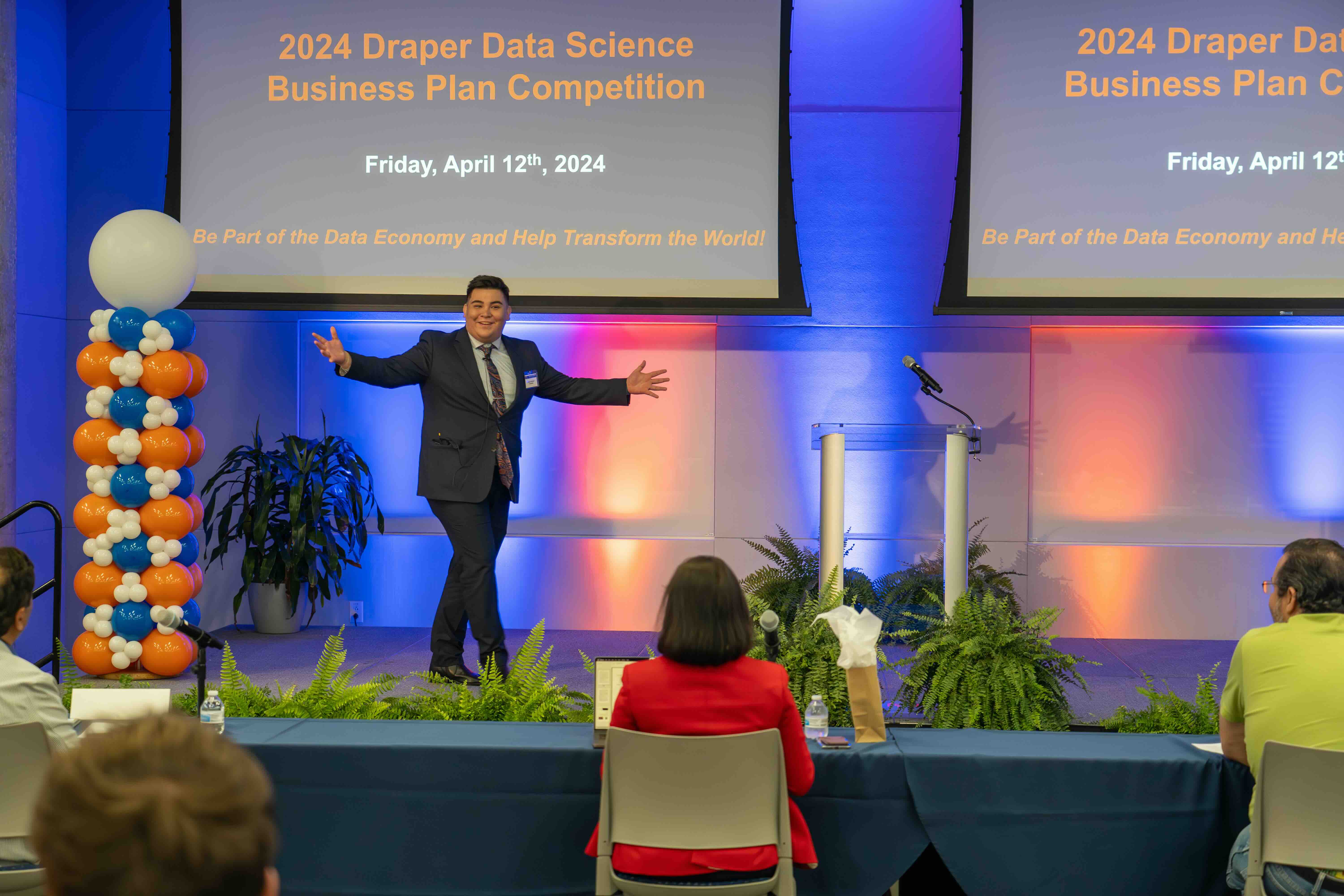 Person on stage at the Draper Data Science Business Plan Competition