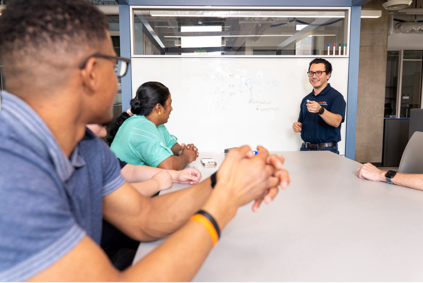 Anthony Rios with students